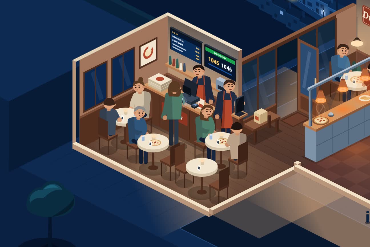 A miniature restaurant with guests dining and staff serving